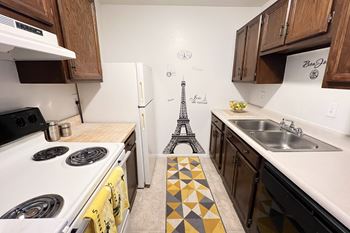 A kitchen with a eiffel tower on the floor